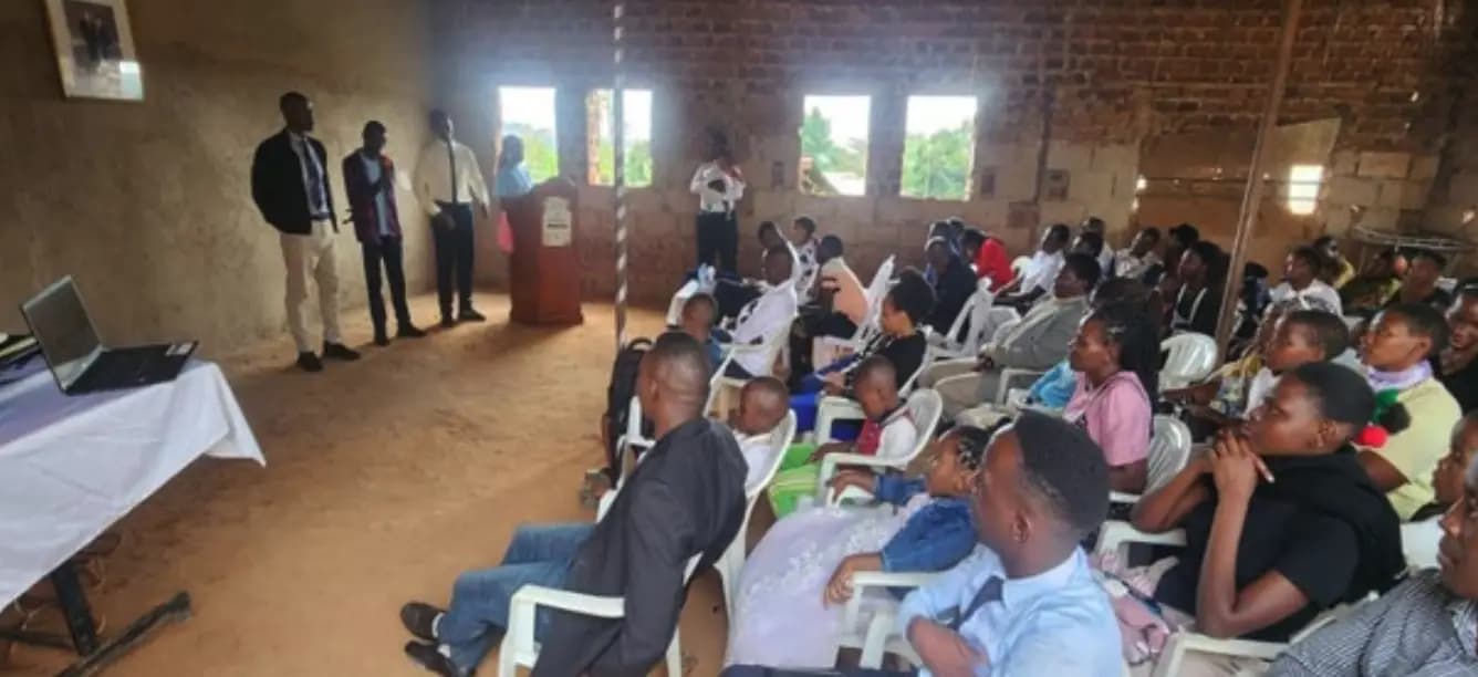 A hall of young people seated during a youth workshop.