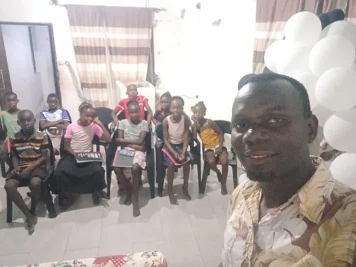 Young people seated together at a KWF-supported youth programme.